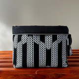 white and black zippered knitting bag