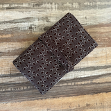 rolled up brown knitting needle case holder