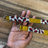 red white lanyard on wood background