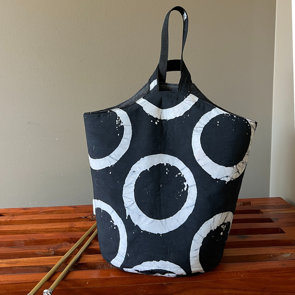 Black tote bag with white circular pattern 