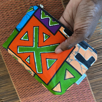 colorful small pouch held in one hand